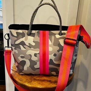 Haute Shore crossbody tote. 14Lx10Hx5D. Grey/white camo w/ hot pink/orange strap